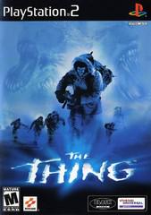 The PlayStation 2 cover of Konami's "The Thing" shows a team in winter gear running through snow, led by a large figure with ghostly faces behind them. Set in an Antarctic research station, this survival horror game is ESRB rated M for Mature, with the title "The Thing" prominently displayed in icy text.