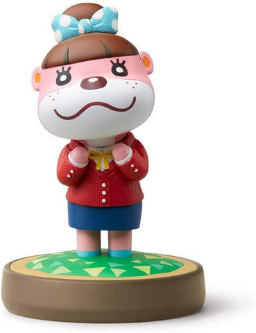 The Lottie (Animal Crossing) figurine by Nintendo features a whimsical design similar to an amiibo for Nintendo platforms. The female otter stands on a round base with a pink face, white snout, and sports a light blue polka-dotted bow in her brown hair. She is dressed in a red sweater with a yellow tie and wears a blue skirt, while her hands are delicately clasped under her chin.