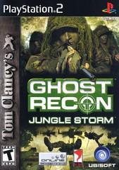 The cover art for the PlayStation 2 game "Ghost Recon: Jungle Storm" by Ubisoft features soldiers in camouflage gear navigating the jungle, capturing the essence of a tactical shooter. The bold white and green title is displayed over a military scene, accompanied by publisher logos such as PlayStation, Ubisoft, and Dolby Surround. The game is rated T for Teen.