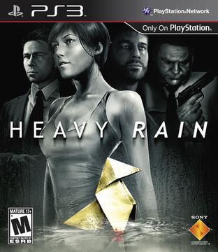 The cover of Quantic Dream's "Heavy Rain" (PS3) shows a woman in a tank top standing in the rain, origami in the foreground, and three suited men looming behind. Includes PlayStation and "Mature 17+" ESRB branding.