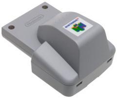 A gray Nintendo 64 Rumble Pak with the iconic Nintendo logo sits on a flat surface. It features a rectangular connector base and a larger, curved top, fitting snugly into the console to enhance gameplay with immersive rumble feedback.