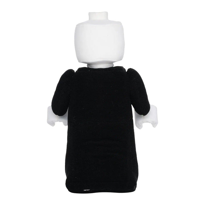 A back view of a character that resembles a Little Shop of Magic LEGO Harry Potter: Lord Voldemort Plush Minifigure, wearing a black robe-like outfit. The figure has a white, smooth, helmet-shaped head and white hands. The outfit contrasts sharply with the head and hands due to the difference in color.