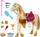 A Barbie Mysteries: The Great Horse Chase Interactive Toy Horse by Mattel with a long golden mane and tail, wearing a pink saddle and silver bridle. Accessories around it include a blue brush, various hair clips, ribbons, carrots, a trophy, a food bowl, a water bucket, and a saddle blanket. The horse’s tack is detailed with heart and jewel designs.