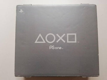 A gray PlayStation 1 Complete in Box from Everything Games, featuring the iconic PlayStation logo and symbols (triangle, circle, X, square) in the center along with "PS one." Perfect for retro gaming enthusiasts, this Sony PlayStation 1 box shows minimal wear on the edges with tiny dents visible on the surface.