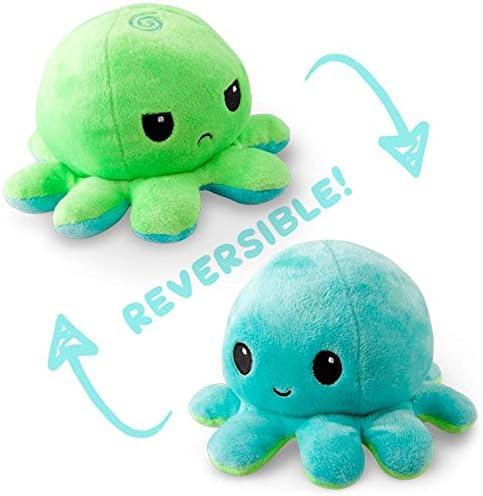 Two plush octopus toys, one green with a frown and one blue with a smile, showcasing their cute reversible plush design. The word "REVERSIBLE!" is written between them with arrows indicating the flipping motion from one octopus to the other. This Everything Games TeeTurtle Reversible Green and Aqua Octopus Plushie is trending on TikTok!