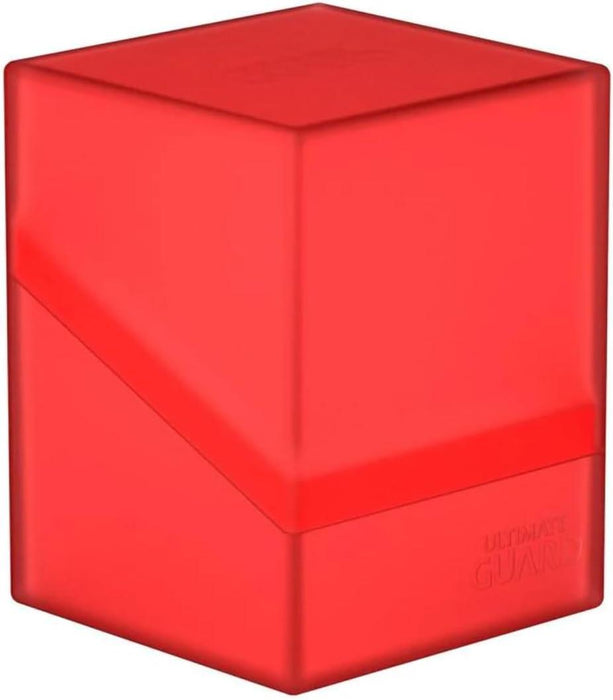 The UG Boulder 100+ Ruby by Ultimate Guard is a semi-transparent red rectangular storage case with slightly rounded edges. The durable box consists of two parts, a lid and a base, with a diagonal cut separating them for secure closure. The brand name "Ultimate Guard" is embossed on the lower right corner of the base.