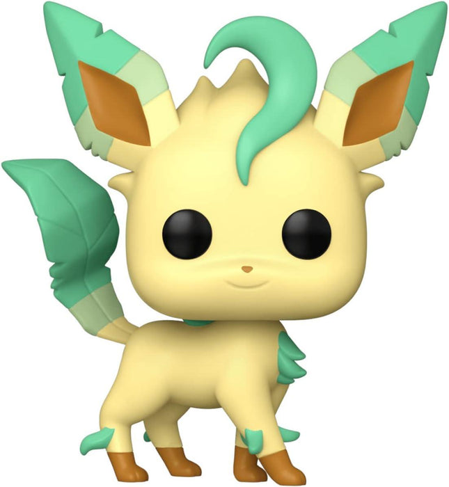 A Funko Pop! Games: Pokemon - Leafeon vinyl figurine, perfect for any Pokémon collection. Leafeon has a cream-colored body with green, leaf-like ears, tail, and tufts on its paws. It has large black eyes and a green tuft of fur on its forehead. The Funko Pop! Games: Pokemon - Leafeon figure boasts a cute, stylized design with minimal details.