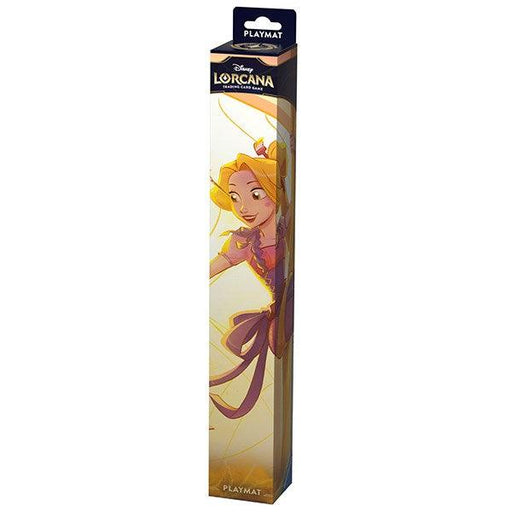 The image shows a Disney Playmat (Rapunzel) box featuring vibrant artwork of Rapunzel. The rectangular box, labeled "Playmat" at the top, displays Rapunzel in a dynamic pose with her long hair flowing, surrounded by glowing golden lines against a dark background—perfect as a desk mat for any fan.