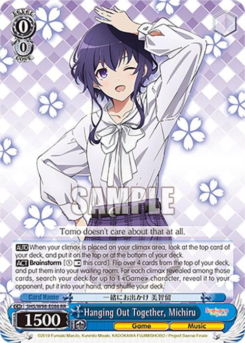 A Bushiroad trading card featuring an anime-style girl with purple hair, wearing a white blouse with a bow. She is winking and smiling, with her left hand on her hip and her right hand raised. The card shows her name "Hanging Out Together, Michiru (SHS/W98-E086 RR) [Saekano the Movie: Finale]," adorned with flowers in the background.