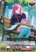 A trading card from the Start Up Trial Deck: Lyrical Monasterio features Rianne with long pink hair, wearing a dark jacket and blue skirt, sitting on a park bench with a musical sheet. The card reads "Breezing Score, Rianne (12) (DZ-TD06/015EN)" and includes her stats: Power 5000, Critical 1, and Shield 5000. When revealed as a trigger, draw a card!