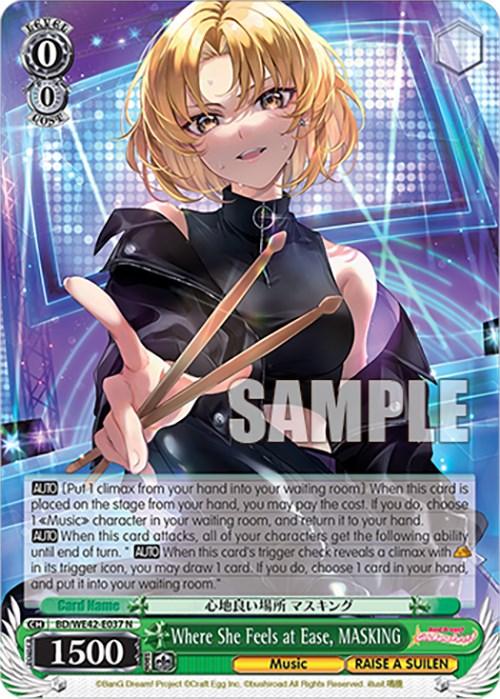 A trading card featuring an anime character named MASKING from the series "RAISE A SUILEN." The character has short blonde hair and wears a black outfit with one arm in a black glove. She strikes a charismatic pose, pointing forward with a confident smile. Part of the Bushiroad product Where She Feels at Ease, MASKING (BD/WE42-E037 N) [BanG Dream! Girls Band Party! Countdown Collection], various game-related text and stats are displayed.