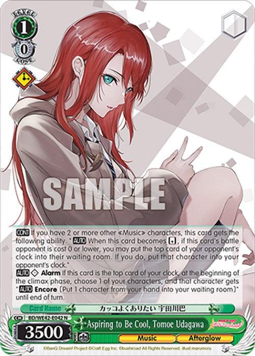 A trading card features an anime-style illustration of a red-haired female character in casual clothing with a neutral expression. She is seated and holds a hooded jacket close to her face. The card, part of the Aspiring to Be Cool, Tomoe Udagawa (BD/WE42-E042 N) [BanG Dream! Girls Band Party! Countdown Collection] by Bushiroad, details abilities for gameplay. The character's name is Tomoe Udagawa.