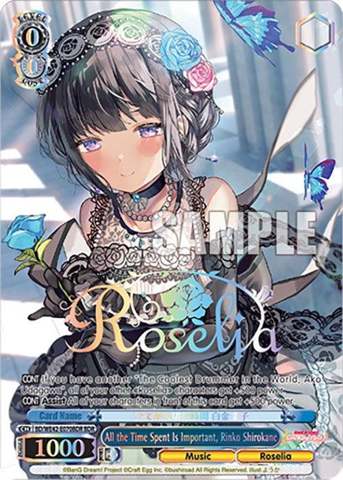 The trading card features an anime-style girl with short dark hair and blue eyes wearing a black lace dress and choker. Blue butterflies and roses surround her. Text includes "Roselia," "All the Time Spent Is Important, Rinko Shirokane," card stats like "Level 0, 1000 power, Cost 0," from All the Time Spent Is Important, Rinko Shirokane (BD/WE42-E070BDR BDR) [BanG Dream! Girls Band Party! Countdown Collection] by Bushiroad