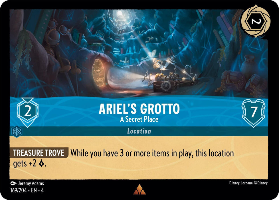 A rare card titled "Ariel's Grotto - A Secret Place (169/204) [Ursula's Return]" from the Disney Lorcana game. The card depicts an underwater cave filled with various objects. It has a blue and gold border and includes a text box which states: "While you have 3 or more items in play, this location gets +2." The card is numbered 169/204.