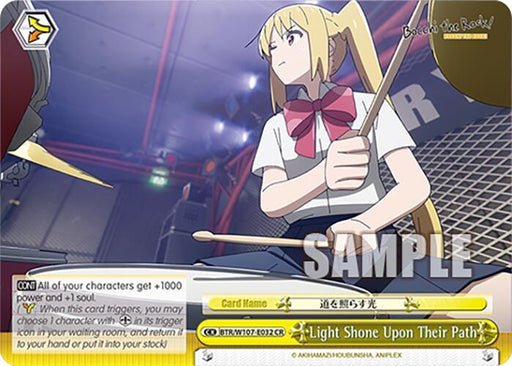 This is a Light Shone Upon Their Path (BTR/W107-E032 CR) [BOCCHI THE ROCK!] trading card from the game "Weiss Schwarz" by Bushiroad, featuring a character from the anime series "BOCCHI THE ROCK!" The card depicts a girl with long blonde hair holding drumsticks in a music studio. The card boasts special effects and associated game rules.