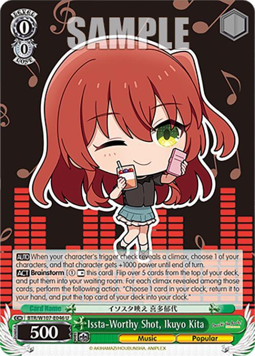 A colorful Character Card featuring a chibi-style character with red hair and green eyes. She is winking and holding a green drink and a smartphone. Titled "Issta-Worthy Shot, Ikuyo Kita (BTR/W107-E046 U) [BOCCHI THE ROCK!]," from Bushiroad, the detailed and vibrant design perfectly captures her Music and Popular attributes.