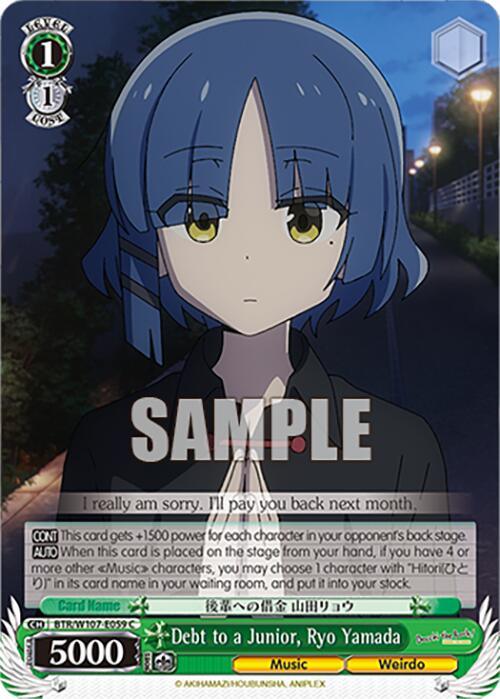 A trading card featuring a character with short blue hair and yellow eyes from BOCCHI THE ROCK!. The character wears a black and red outfit, standing with hands clasped together. Text at the bottom reads "Debt to a Junior, Ryo Yamada (BTR/W107-E059 C) [BOCCHI THE ROCK!]," with stats and abilities listed. Background shows a dimly lit, outdoor setting. This product is brought to you by Bushiroad.