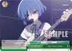 A blue-haired character with a serious expression plays a white bass guitar onstage, surrounded by microphones and speakers. The background shows a musical performance setting. The card, labeled "BOCCHI THE ROCK!", displays various icons, text in different languages, and the title "My Own Color (BTR/W107-E064 CR) [BOCCHI THE ROCK!]" at the bottom. This product is from Bushiroad.