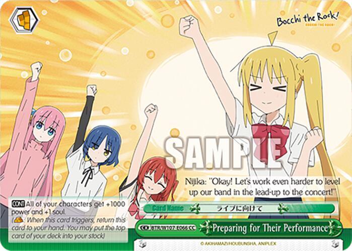 An anime-style card from BOCCHI THE ROCK features four characters: a blonde girl in a white shirt and red tie, raising her fist, with three other girls with pink, blue, and red hair behind her. Titled "Preparing for Their Performance (BTR/W107-E066 CC) [BOCCHI THE ROCK!]," this vibrant card by Bushiroad includes colorful, dynamic elements against a bright background.