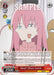 A **What? Hitori Gotoh (BTR/W107-E085S SR) [BOCCHI THE ROCK!]** trading card by **Bushiroad** showcases a character with pink hair, adorned with a hairpin and side-swept fringe. The character wears a matching pink top, while text details abilities and statistics. The card design includes various symbols and attributes.