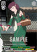 A Bushiroad An Ren (RWBY/WXE01-15OFR OFR) [RWBY: Premium Booster] collectible card showcases a purple-haired character in a green outfit carrying a basket. The character, An Ren, has their eyes closed and appears thoughtful. The Over-Frame Rare card is labeled "Level 0" with a power of 4000 and the text: "You cannot play events or 'Backup' from your hand.