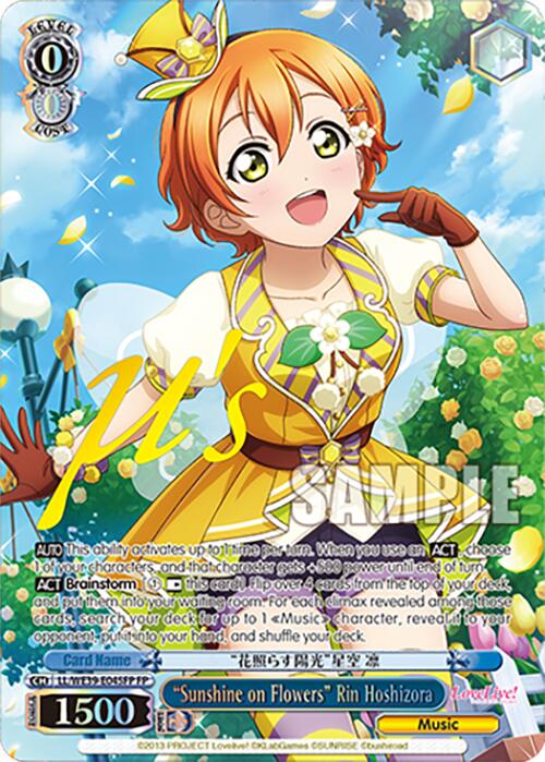 This is a colorful 10th Anniversary trading card named "Sunshine on Flowers" Rin Hoshizora (LL/WE39-E045FP FP) [Love Live! School Idol Festival 10th Anniversary] from Bushiroad. The card features a smiling anime character, Rin Hoshizora, dressed in a yellow and white outfit with a matching hat adorned with a bow, set against a background of green foliage and white flowers. The card stats and text are displayed at the bottom.