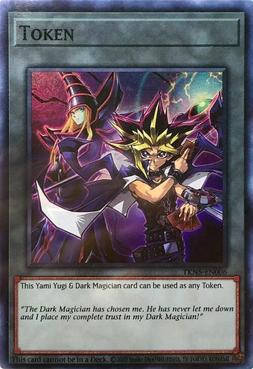 Image of a Yu-Gi-Oh! Super Rare token card [TKN5-EN006] showcasing Yami Yugi standing confidently with crossed arms alongside Dark Magician in a casting stance. The card text states, "This powerful duo can be used as any Token.