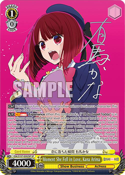 The "Moment She Fell in Love, Kana Arima (OSK/S107-E002SP SP)" trading card from Bushiroad showcases an anime-style character with red hair, dressed in a purple coat and hat adorned with a red ribbon. Holding a white and pink rectangular paper, the card features text in both Japanese and English. The background is yellow with pink accents, depicting a scene from "[OSHI NO KO] Show Business.