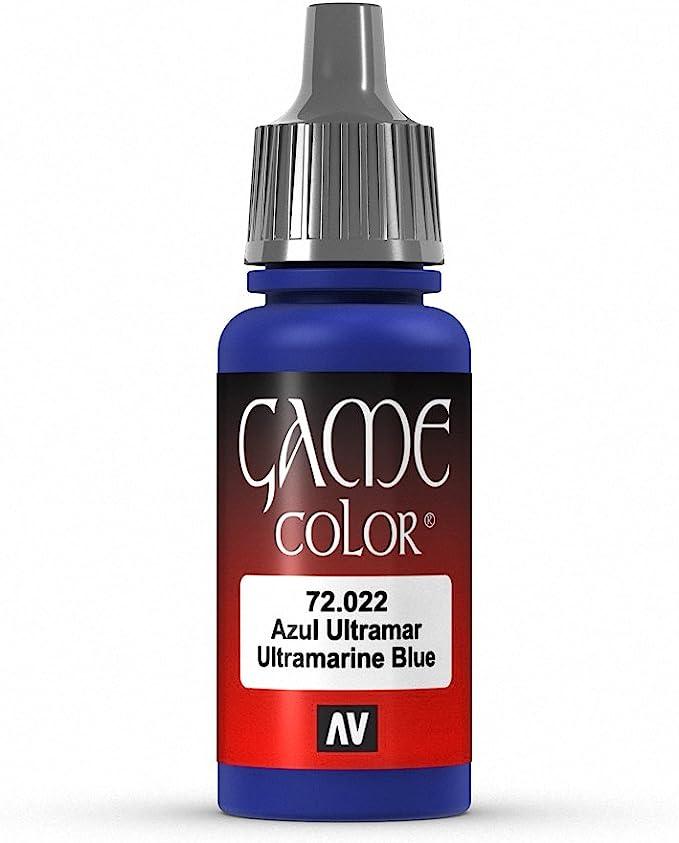 A small bottle of Vallejo Ultramarine Blue Paint, 17ml, features a gray dropper cap and the label "Game Color" in blue. It showcases "72.022 Azul Ultramar Ultramarine Blue" along with an "AV" logo at the bottom. Renowned for its highly pigmented acrylic colors, this paint is perfect for coating fantasy figures with matte and opaque finishes against a plain white background.