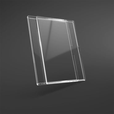 A Game Genic Slide Card Case is shown against a dark gray background, highlighting its slim design and rounded edges. The transparent, clear plastic case features UV protection, while a subtle reflection beneath suggests its glossiness.