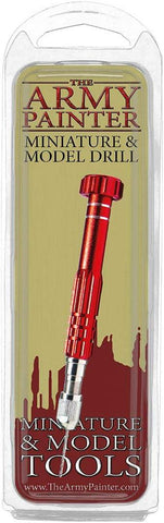 The Army Painter Miniature and Model Drill is ideal for hobbyists, featuring a red metal tool under a clear plastic cover. A gold label with maroon text and cityscape sparks creativity. Perfect for miniature figures enthusiasts, explore at www.TheArmyPainter.com.