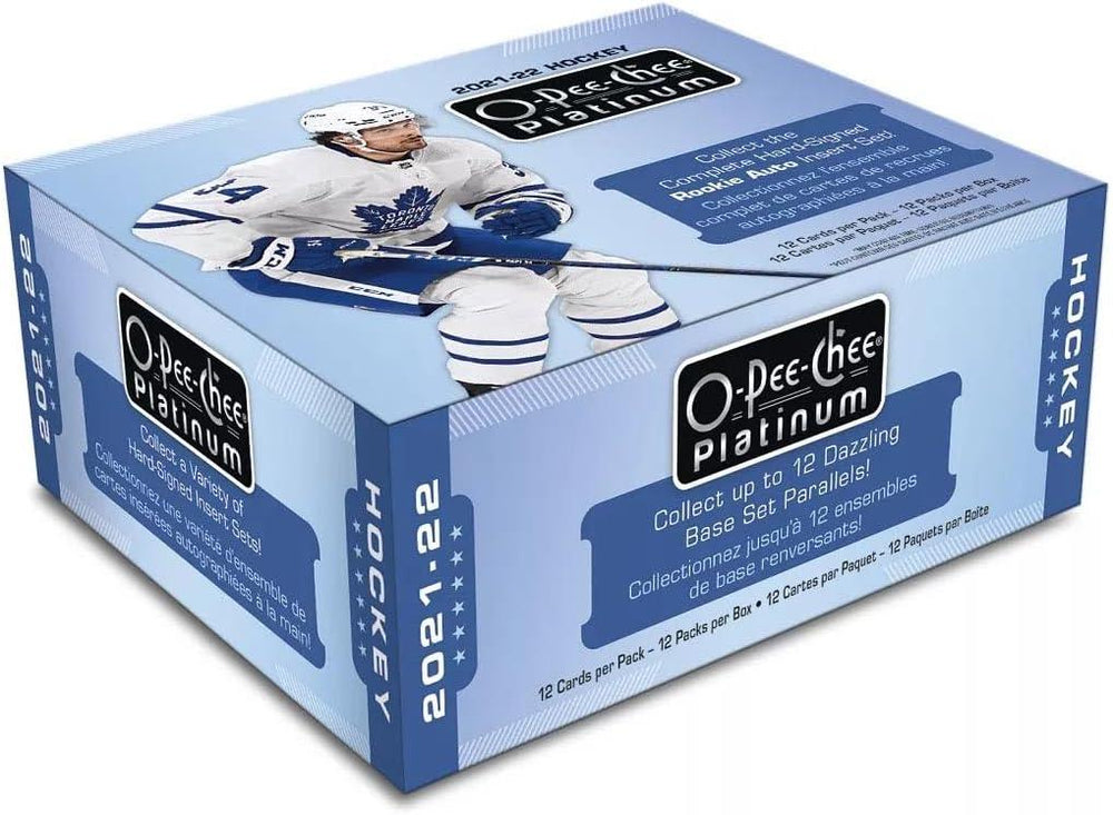 An Upper Deck 2021-22 O-Pee-Chee Platinum Hockey Hobby Box in blue presents a hockey player in a white and blue uniform on the lid. The box highlights "12 Cards per Pack – 12 Packs per Box – 12 Boxes per Case," showcases "Marquee Rookies," and promotes "12 Dazzling Base Set Parallels.