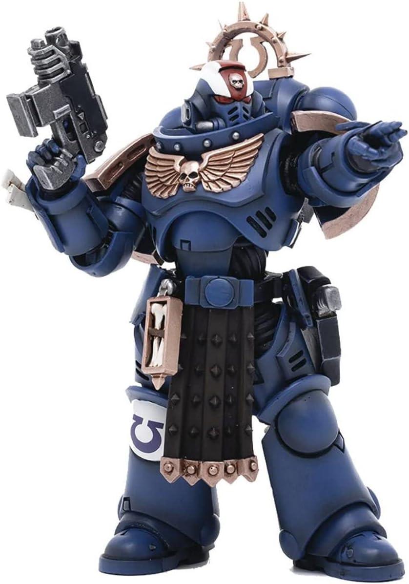 The Joytoy BLOOMAGE JOYTOY Warhammer 40K Ultramarines Primaris Lieutenant Amulius action figure features detailed blue and gold armor with a skull emblem. It has weapon accessories, a gesturing hand, and a helmet with red eye lenses and a white crest.