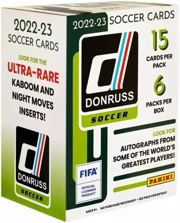 The 2022-23 Panini Donruss Soccer Blaster Box displays "15 cards per pack" and "6 packs per box." It features "Ultra-Rare Kaboom and Night Moves Inserts," sought-after Rated Rookies, Beautiful Game Autographs, and FIFA logos.