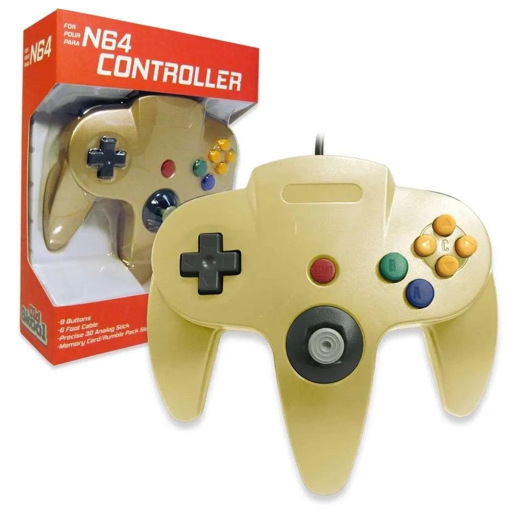 The Old Skool Gold N64 Controller is displayed in front of its red and white packaging. It includes a joystick, a D-pad, colorful buttons like yellow C buttons, a blue "A" button, and a green "B" button. The packaging is labeled "Old Skool Gold N64 Controller" and shows the same controller.