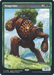 A rare fantasy card titled "Vengevine [World Championship 2024]" from Magic: The Gathering depicts a large, humanoid tree creature walking through a grassy landscape with mountains in the background. This Creature Elemental has a muscular form with pinecones embedded in its bark, four limbs, and emits a sense of motion and strength. The card's stats are 4/3 and it will feature prominently in the World Championship 2024.