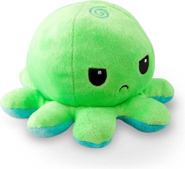 A TeeTurtle Reversible Green and Aqua Octopus Plushie by Everything Games is shown. It is light green with eight short tentacles that have blue tips. The toy has large, black eyes with white reflections and a small, frowning mouth. A spiral design is visible on top of its head, giving it a slight whimsical touch. Ideal for TikTok!