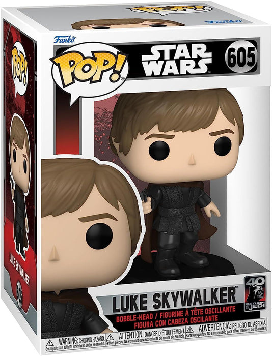 A Funko Pop! Star Wars: Return of The Jedi 40th Anniversary, Luke Skywalker vinyl bobblehead featuring Luke Skywalker from Star Wars, boxed. The figure is number 605 and depicted in dark clothing. The left side panel of the box showcases an illustration of the figure, while the front displays the Pop! and Star Wars logos.