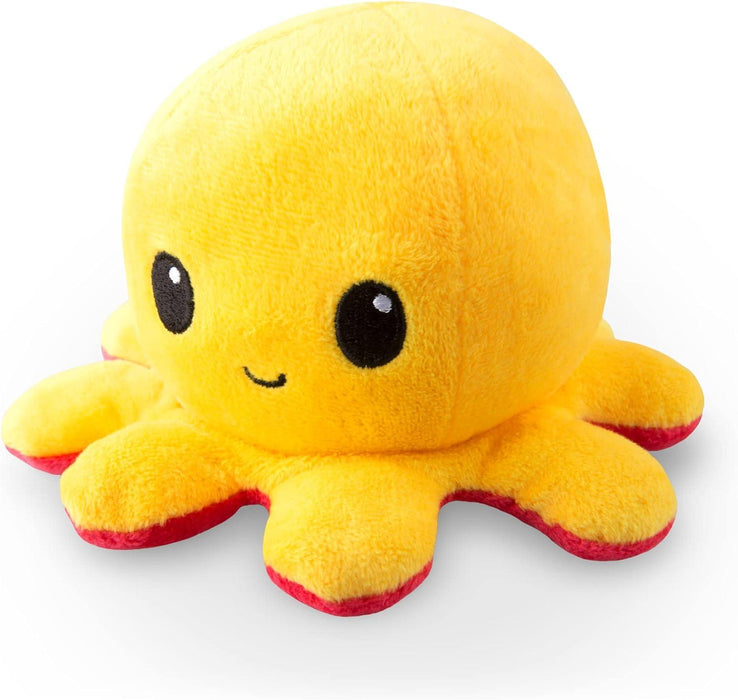A TeeTurtle BIG Reversible Red and Yellow Octopus Plushie by Everything Games, with a bright yellow body and eight short, rounded legs featuring red undersides. The octopus has large, friendly black eyes and a small, smiling mouth. This Everything Games creation is soft and suitable for cuddling.