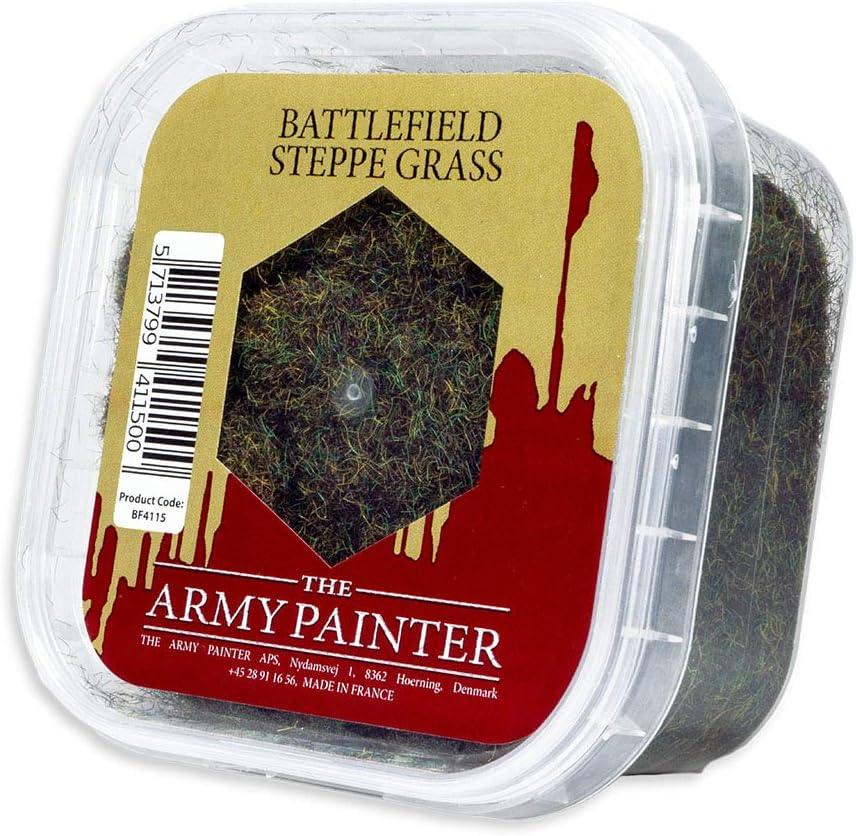 A close-up image of a plastic container of Army Painter's The Army Painter Battlefield: Steppe Grass Basing, ideal for creating realistic models. The see-through container has a red label with a clear window showing green artificial grass inside. The label includes a barcode, product code BF4115, and mentions it's made in France. Plus, it's easy-to-store!