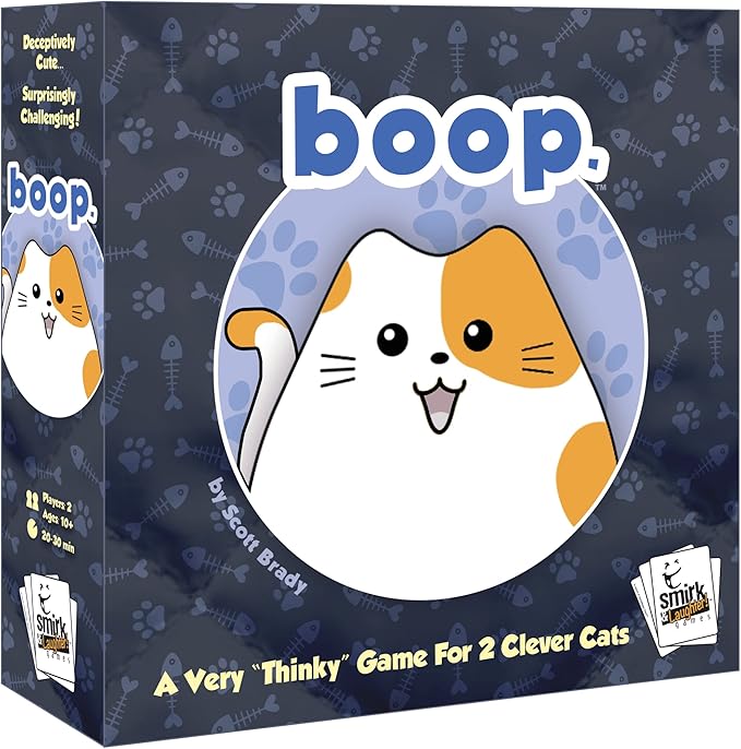 The image displays the game box "boop." by Smirk & Dagger Games, with a smiling round cat illustration. It's called "A Very 'Thinky' Game For 2 Clever Cats," featuring cat pieces on a quilted board, suitable for ages 10+, lasting 20-30 minutes, created by Scott Brady.