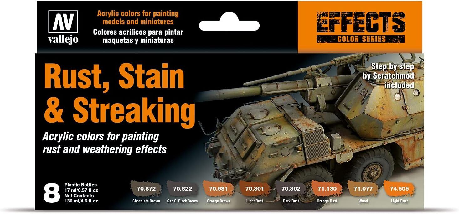 The Vallejo Rust, Stain and Streaking Set includes eight acrylic shades in plastic bottles to prevent drying. It features color names, item numbers, and an image of a weathered military vehicle model with 