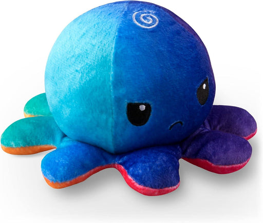 This cute TeeTurtle Reversible Sunset and Mermaid Octopus Plushie from Everything Games is the perfect gift! It features a slightly angry expression and divides into two vibrant halves, with one side in shades of blue and turquoise, and the other in a mix of purple and blue. Its large dark eyes are set on the blue side, highlighting a detailed spiral pattern on its head.
