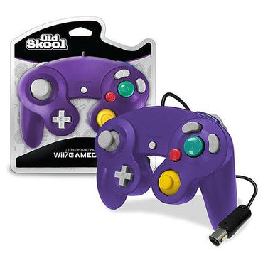 The Old Skool Indigo Gamecube/Wii Controller features analog joysticks, a D-pad, pressure-sensitive colorful buttons, and a wired connection with the cord extending from the bottom. The packaging highlights its compatibility with both Wii and GameCube systems.