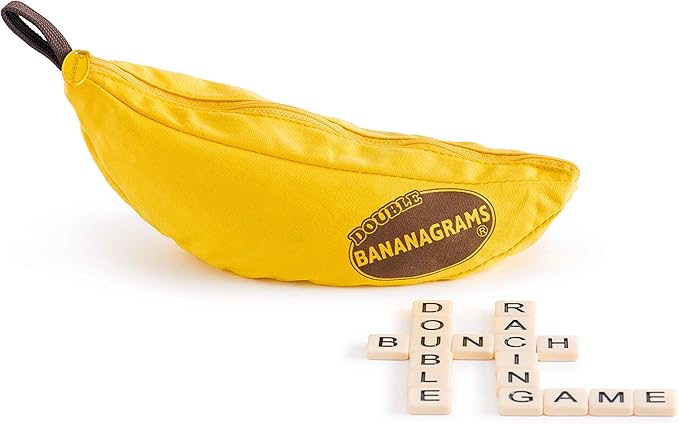 A yellow banana-shaped zippered pouch labeled "Double Bananagrams" with a Bananagrams logo sits on a white surface. Below, wooden letter tiles form "DOUBLE BUBBLE RACING GAME" crossword style, an exciting educational travel game for fans of fun.