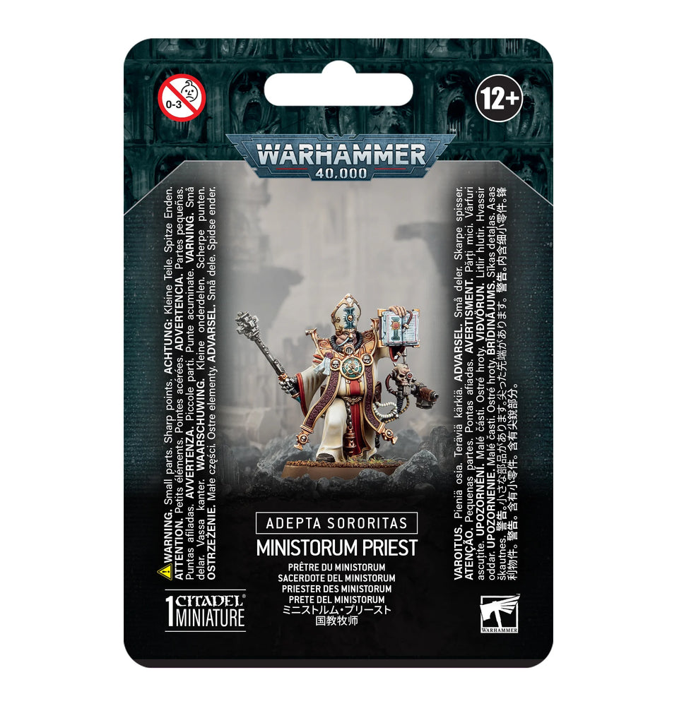 The ADEPTA SORORITAS: MINISTORUM PRIEST by Games Workshop features striking box art of a robed Ministorum Priest with a staff. Product details and the 12+ age recommendation are multilingual, with the Citadel logo neatly positioned at the bottom.