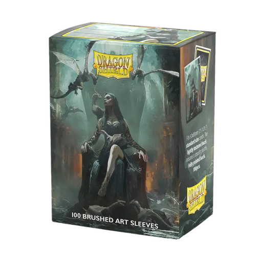 The image features a box of Arcane Tinmen's Halloween 2024 Brushed Art Sleeves, depicting a dark fantasy scene perfect for Halloween. It illustrates a seated female figure wielding a sword, enveloped by dragons in a misty setting. The box highlights "100 Standard Size Brushed Art Sleeves," ideal for safeguarding your trading cards.