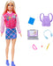 A Mattel Barbie-I Love School-Blonde Doll featuring a doll with long blonde hair, sporting a pink and red varsity jacket, a blue and purple plaid skirt, and blue sneakers. The back-to-school set includes a blue book, lavender backpack, laptop, light blue headphones, pink protractor, eraser, and yellow ruler.