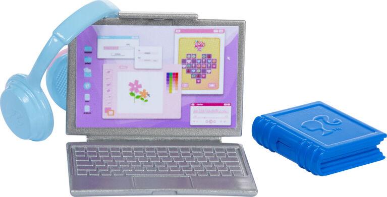 A small Mattel Barbie-I Love School-Blonde Doll playset featuring a silver laptop, a pair of blue headphones, and a closed blue book. The laptop screen displays colorful graphics including flowers and a heart, suggesting a creative design application. Perfect for back to school fun, the book has a question mark symbol on its cover.