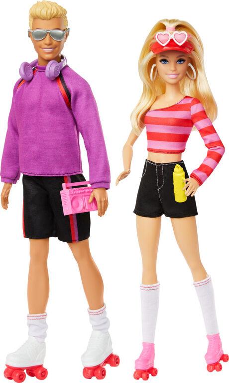 Two dolls stand side by side wearing roller skates, celebrating the 65th anniversary of Ken and Barbie Fashionista Doll 2pack 65th Anniversary. The doll on the left has short blond hair, sunglasses, a purple shirt, black shorts, and holds a pink radio. The doll on the right has long blond hair, a pink visor, striped crop top, black shorts, pink heart-shaped sunglasses on her head. This product is from Mattel.